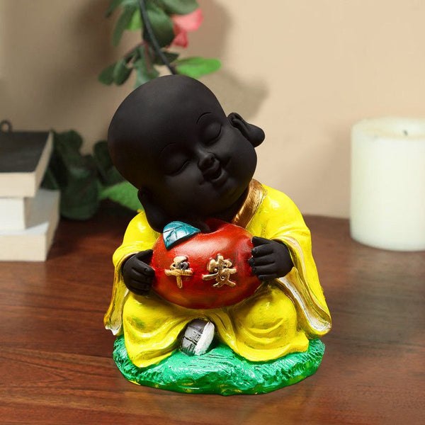 Handcrafted Ployresin Sitting With Taking Apple In Hand Lord Buddha Statue Showpiece Home Decor/Office Decor/Spiritual Gift, Yellow Colour - Karigaari India Aesthetic Home Decor