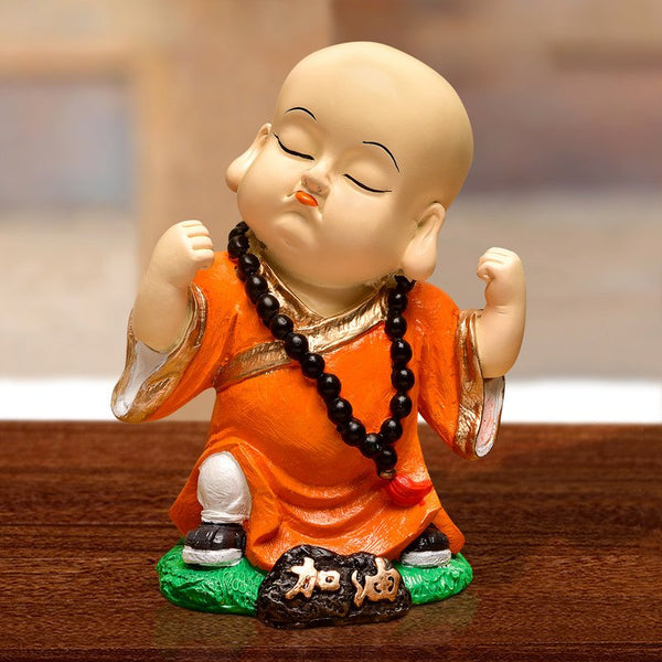 Handcrafted Ployresin Standing And Making Fist Of Fingers Lord Buddha Orange Colour Statue Showpiece Home Decor/Office Decor/Spiritual Gift - Karigaari India Aesthetic Home Decor