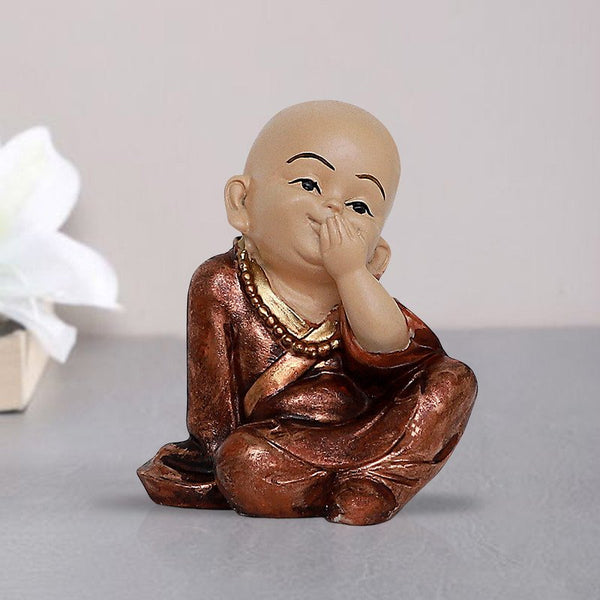 Handcrafted Ployresin Lord Buddha Sitting With Putting Hand On Mouth Statue Showpiece Home Decor/Office Decor/Spiritual Gift, Shiny Brown - Karigaari India Aesthetic Home Decor