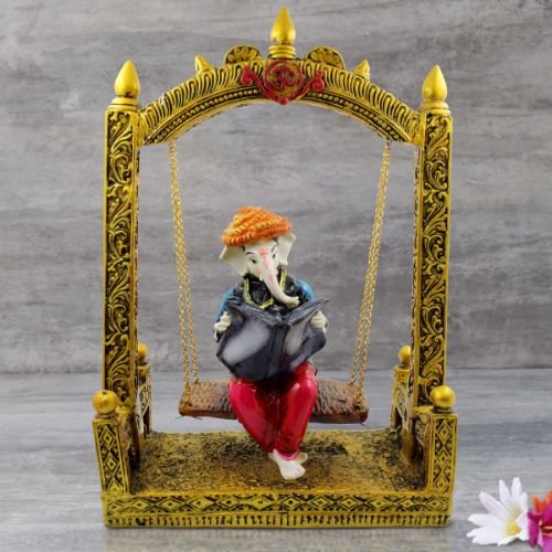 Lord Ganesha Sitting on Jhula Reading newspaper Idol for Home Decor - Karigaari India Aesthetic Home Decor
