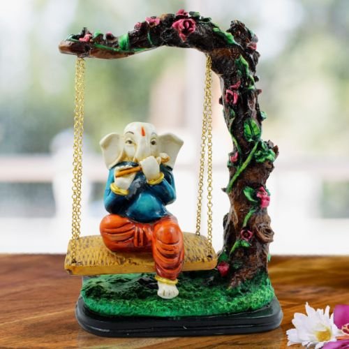Lord Ganesha Sitting on Jhula Playing Flute Idol for Home Decor - Karigaari India Aesthetic Home Decor