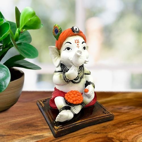Little Lord Ganesha Sitting & Eating Laddu Idol Best for Home Decor