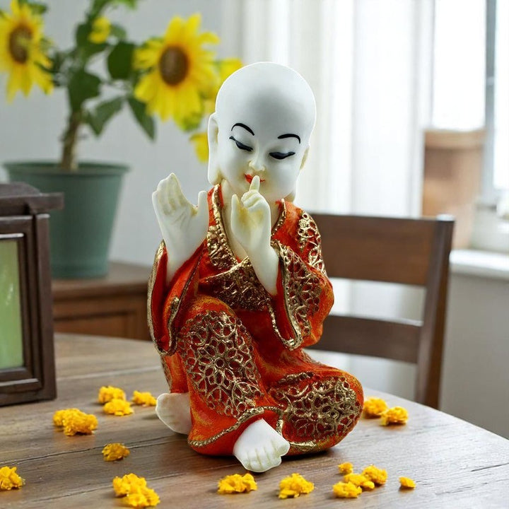 Handcrafted Ployresin Lord Buddha Sitting And Putting Finger On Mouth Statue Showpiece Home Decor/Office Decor/Spiritual Gift, White And Orange - Karigaari India Aesthetic Home Decor