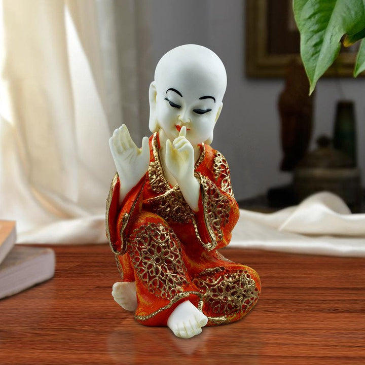 Handcrafted Ployresin Lord Buddha Sitting And Putting Finger On Mouth Statue Showpiece Home Decor/Office Decor/Spiritual Gift, White And Orange - Karigaari India Aesthetic Home Decor