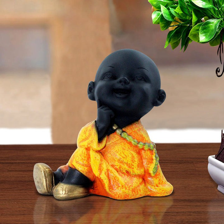 Handcrafted Ployresin Lord Buddha Sitting And Thinking Statue Showpiece Home Decor/Office Decor/Spiritual Gift, Black And Orange - Karigaari India Aesthetic Home Decor