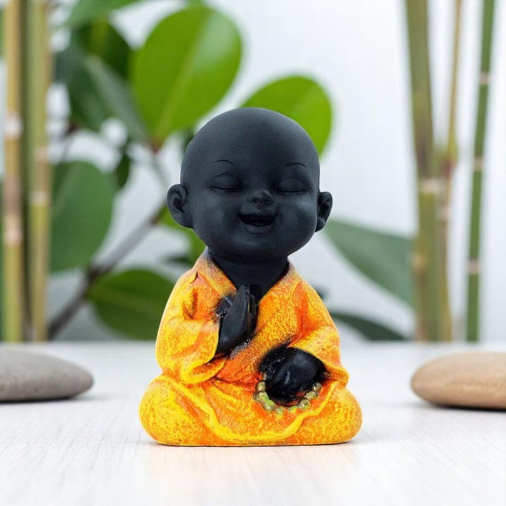 Handcrafted Ployresin Lord Buddha Sitting And Praying Statue Showpiece Home Decor/Office Decor/Spiritual Gift, Black And Orange - Karigaari India Aesthetic Home Decor
