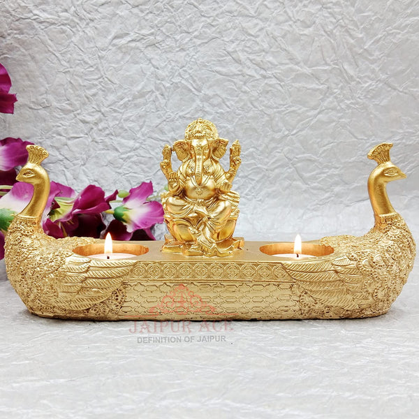 Golden Ganesha Idol with Peacock Design & Tealight Holder – Premium Resin Decorative Showpiece for Home Temple & Gifting