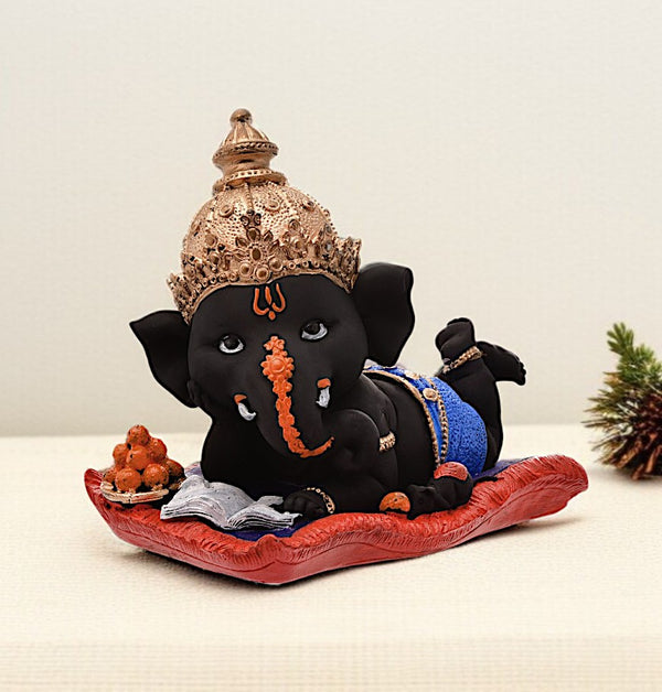 Peaceful Repose Ganesha: Intricately Crafted Resin Reclining Idol with Offerings - Spiritual & Serene - Karigaari India Aesthetic Home Decor