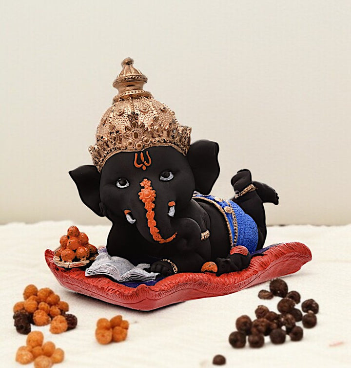 Peaceful Repose Ganesha: Intricately Crafted Resin Reclining Idol with Offerings - Spiritual & Serene - Karigaari India Aesthetic Home Decor