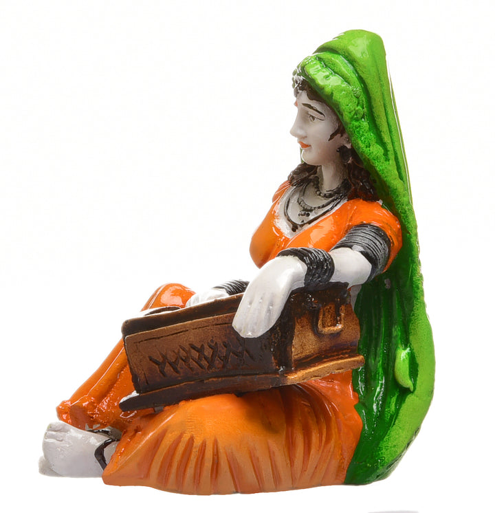 Musical Heritage Figurine: Hand-Painted Resin Rajasthani Lady Playing Instrument - Karigaari India Aesthetic Home Decor