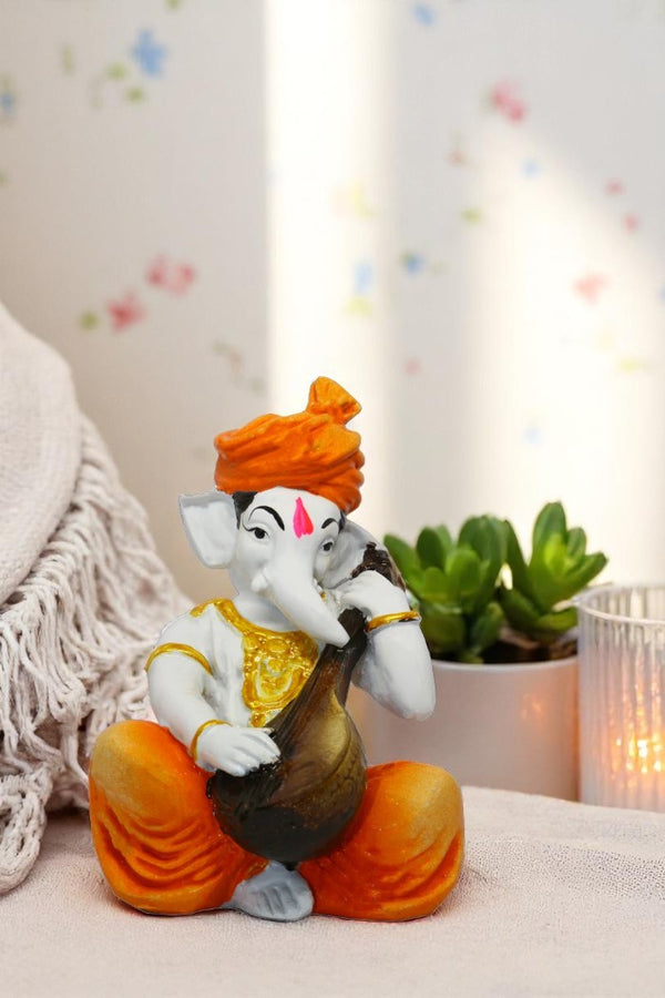 Enchanting Ganesha: Handcrafted Resin Sitar Statue - Blessings & Harmony - Karigaari India Aesthetic Home Decor