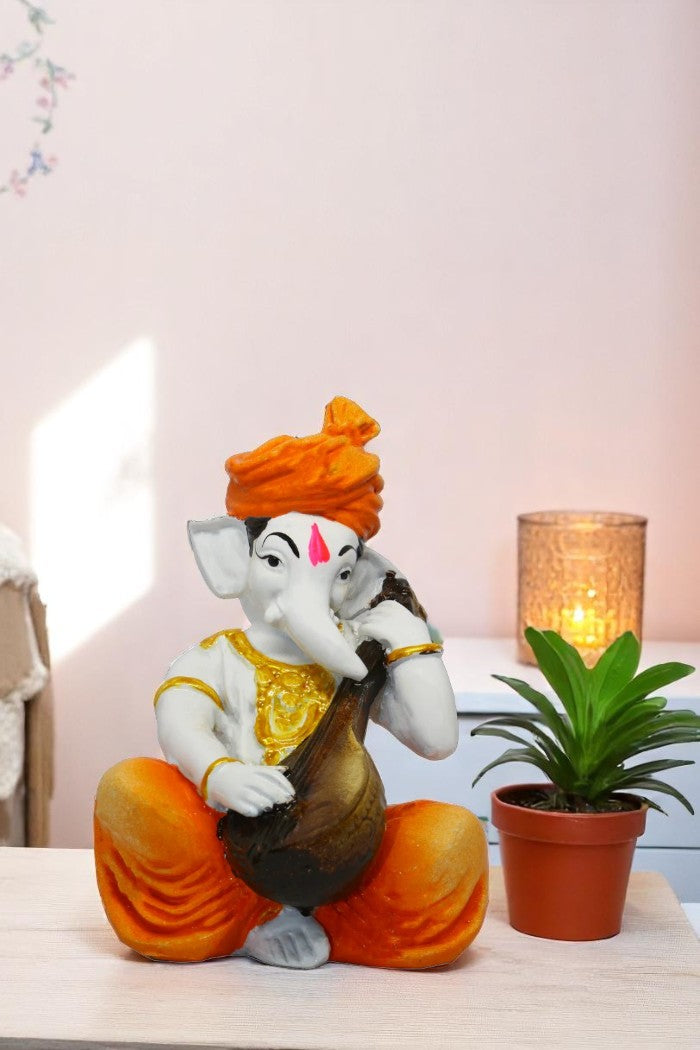 Enchanting Ganesha: Handcrafted Resin Sitar Statue - Blessings & Harmony - Karigaari India Aesthetic Home Decor