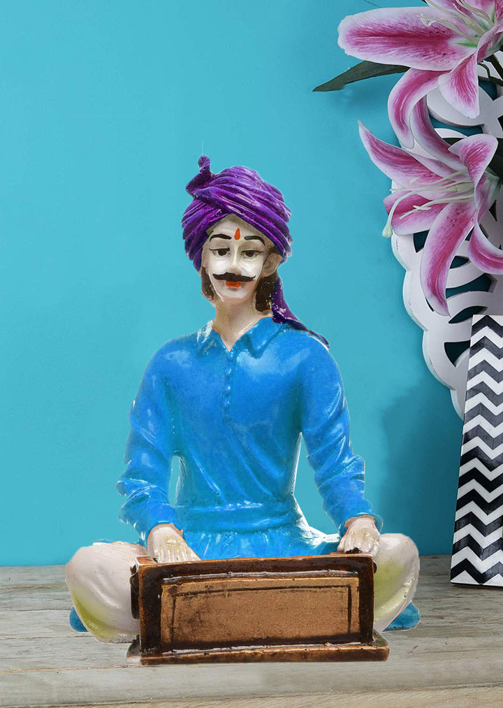 The Silent Symphony of Rajasthan: Hand-Painted Resin Man and His Harmonium's Tale - Karigaari India Aesthetic Home Decor