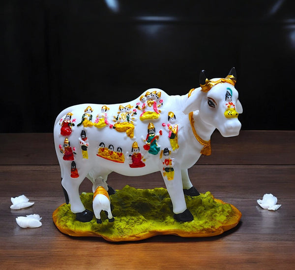 Karigaari India Kamdhenu Cow Idol with Calf | Divine Resin Figurine Decorated with Hindu Deities for Home Mandir Temple Table Decor | Vastu Pooja Gift Item for Peace Prosperity and Wealth